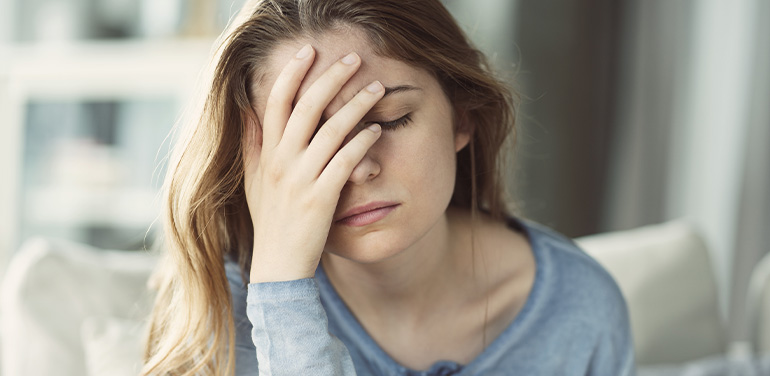 woman-looking-anxious-with-her-hand-over-her-face.jpg